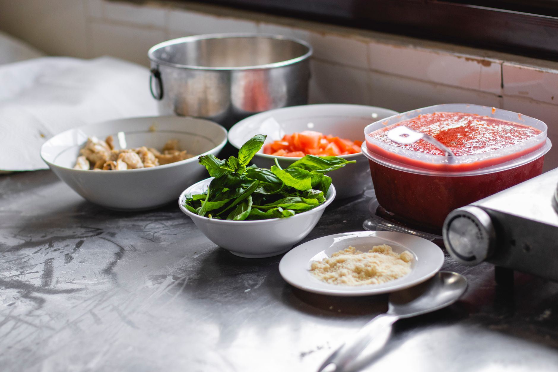 Ingredients and a partially prepared meal arranged on a kitchen counter.